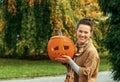 Woman showing Halloween pumpkin Jack OÃ¢â¬â¢Lantern Royalty Free Stock Photo